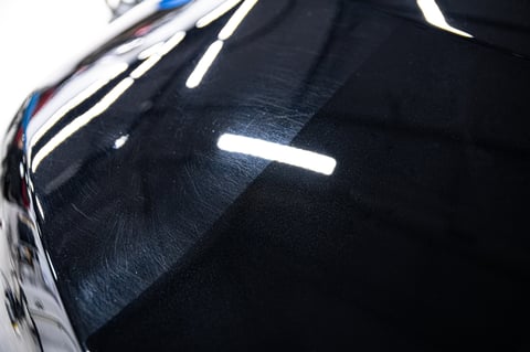 Car paint polishing before and after - swirl marks removed