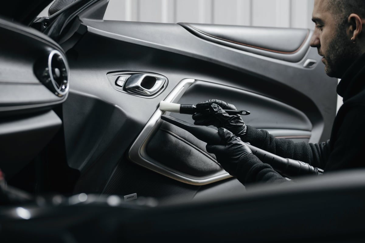 Professional interior car detailing - clean leather seats and dashboard
