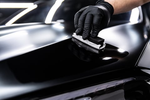 Ceramic coating application on black car in Greensboro NC - professional paint protection